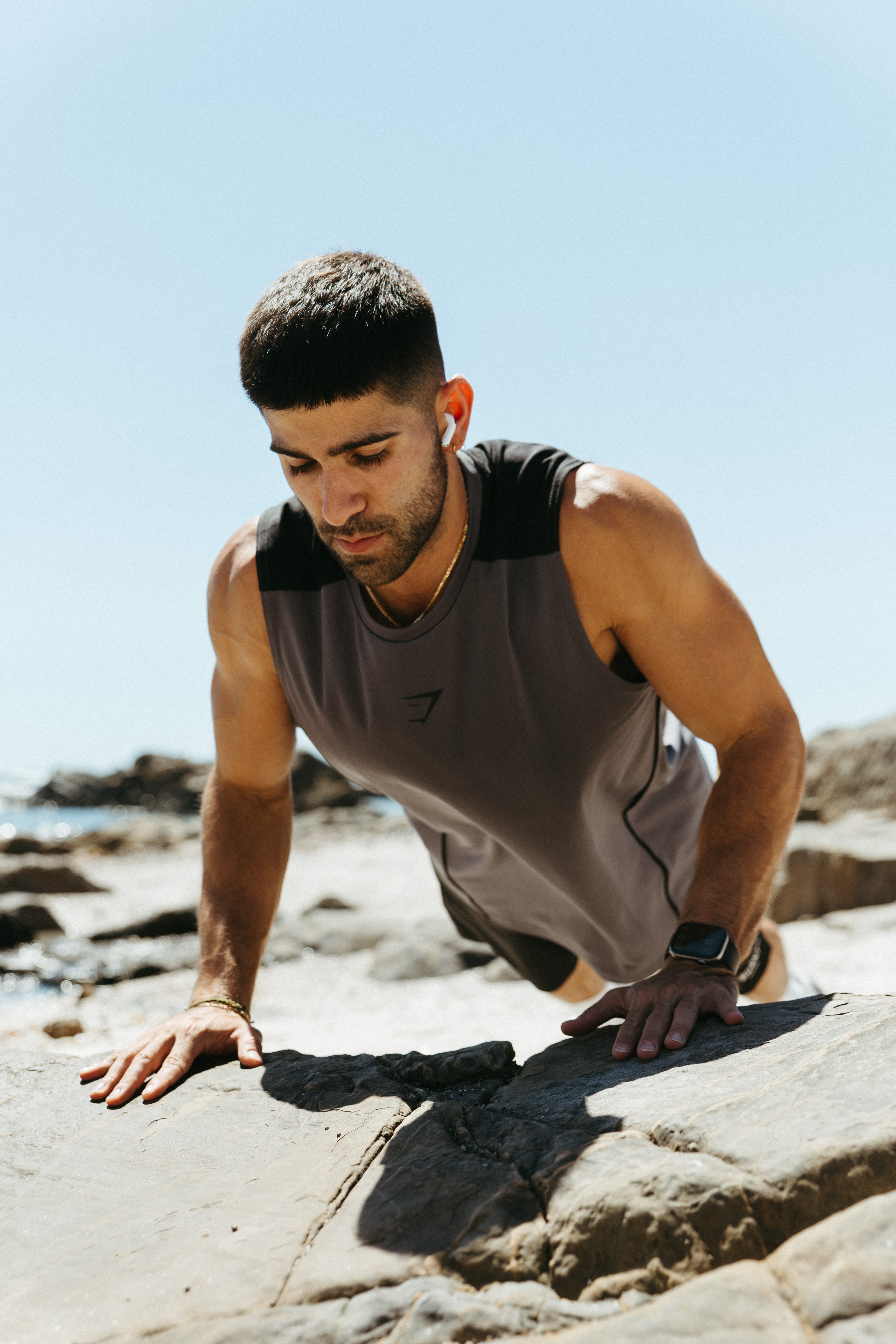 Joe training outdoors with dumbbells